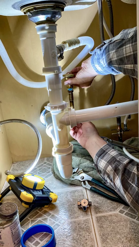Fixing pipes under a sink