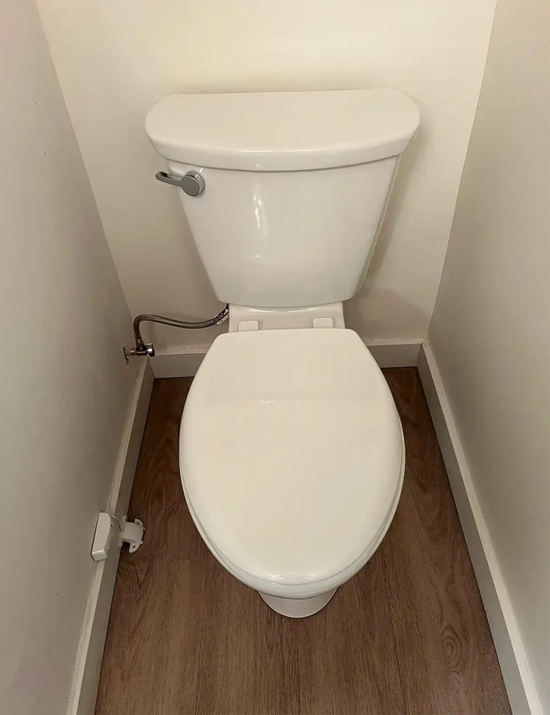 New toilet in a small bathroom